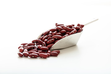 Raw red beans in a metallic scoop