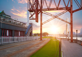 Empty road and iron tower with city landmark architecture backgr