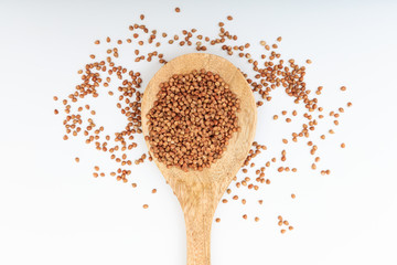 Buckwheat in a wooden spoon