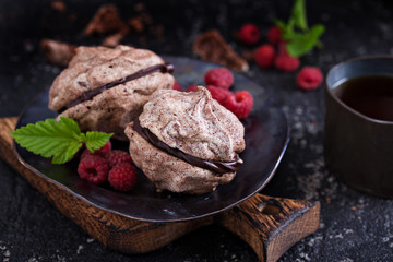 Meringue dessert with chocolate and raspberries