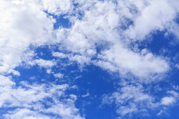 Blue sky background with white clouds. The vast blue sky and clouds sky on sunny day. White fluffy clouds in the blue sky.