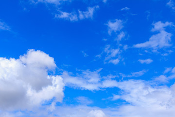 Obraz premium Blue sky background with white clouds. The vast blue sky and clouds sky on sunny day. White fluffy clouds in the blue sky.