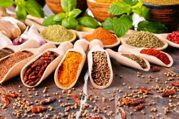 Foto auf Alu-Dibond Variety of spices on kitchen table © monticellllo