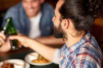 happy male friends drinking beer at bar or pub