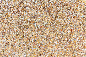 Small sand stone of sand wall texture or sand wall background. Natural brown sand stone for design with copy space for text or image.