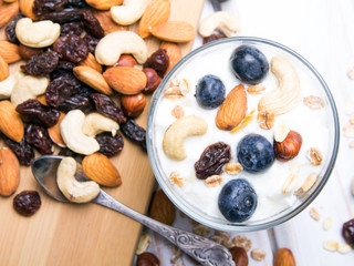 Healthy dessert with yogurt, nuts, oats and blueberries