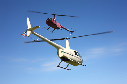 Aircraft - Two small helicopters in flight