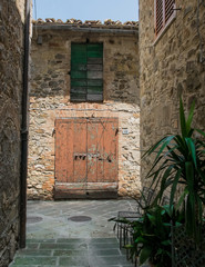Narrow street in Castelnuovo dell'abate, montalcino, tuscany - 117833641