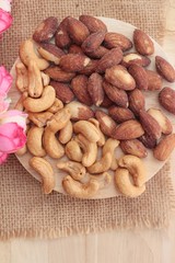 Almonds and cashew is delicious on wood background.