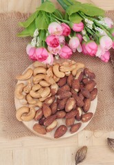 Almonds and cashew is delicious on wood background.