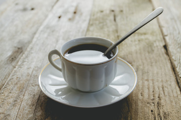 Black coffee on rustic table