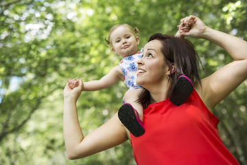 Obraz premium Mother and daughter in forest having fun