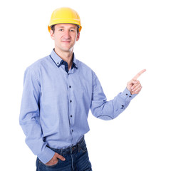 middle aged business man or architect in yellow builder's helmet