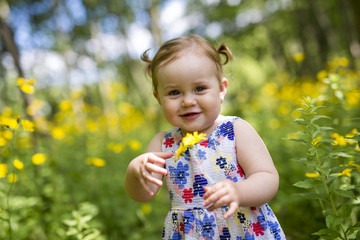 Little girl in the forest park