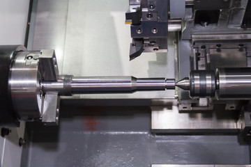 Steel metal cutting machine process by CNC lathe in workshop