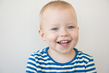 Smiling boy in striped t-shirt. Close-up