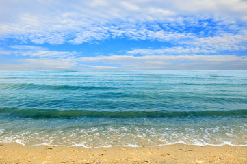 Fototapeta na wymiar Black sea beach blue sky sand sun daylight