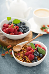 Granola and berries with coffee