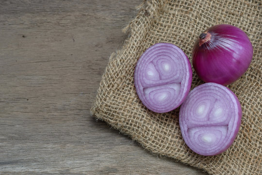red onions on a wooden background