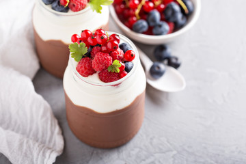 Chocolate pudding with cream and fresh berries