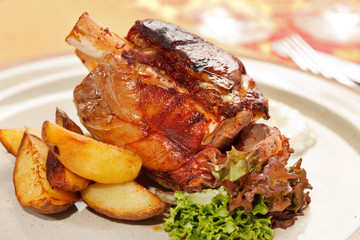 roasted pork knuckle with potatoes