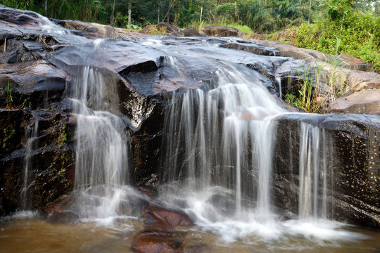Waterfall in tropical forest.