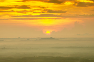 Sunrise and blue mountain with mist.