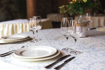 Partly decorated table in restaurant. Close up.