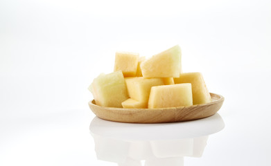 melon slice on wooden plate