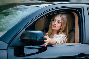 Girl in car arrange mirrow of back view
