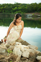 girl look into water of lake
