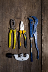 Tools at the old wooden table, chisel, hammer