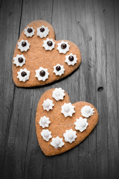 Heart shaped cookies on dark wooden background