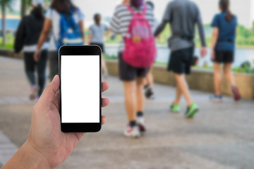 man hand holding the phone and white screen with blur background