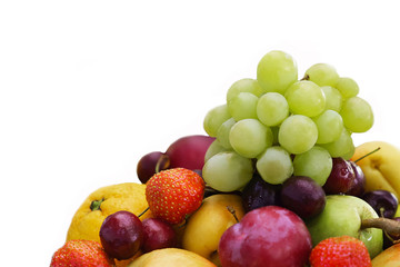 Mix fruit and berries isolated on a white background. Assorted strawberries and grapes, apples and oranges. Healthy fruits for diet rich in vitamins. Food for vegetarians.