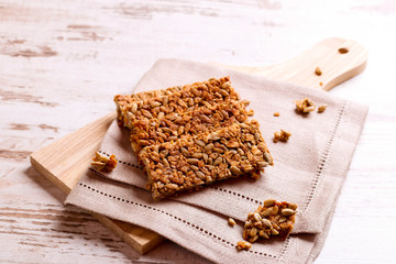 Healthy granola bar on wooden background