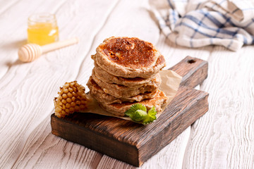 pancakes with honey, decorated mint for breakfast, horizontal