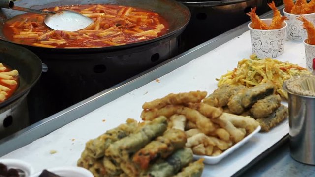Seoul, Korea variety of Korean street food stall, tteokbokki, fish hotdog, sausage and other fried food on stick