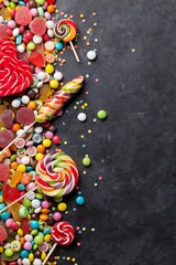 Gordijnen Colorful candies, jelly and marmalade over stone © karandaev