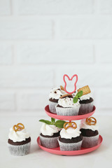 Chocolate cupcakes on a white wooden table