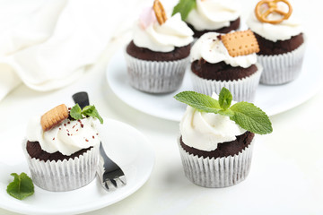 Chocolate cupcakes on a white wooden table