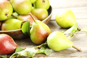 Ripe pears on grey wooden table