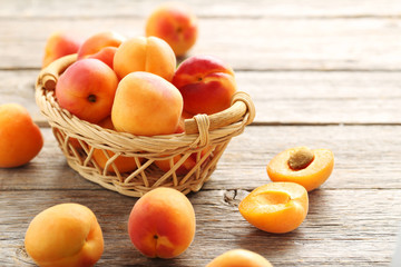 Ripe apricots fruit on grey wooden table