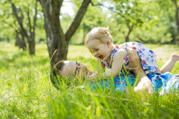 father with her baby outdoor at park