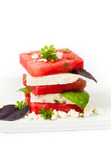 Watermelon Salad with Feta isolated on white. Selective focus.