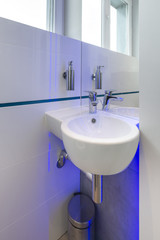 Close up of oval corner washbasin
