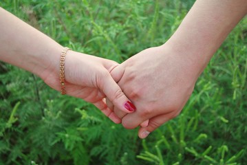 young couple holding hands