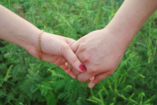 young couple holding hands