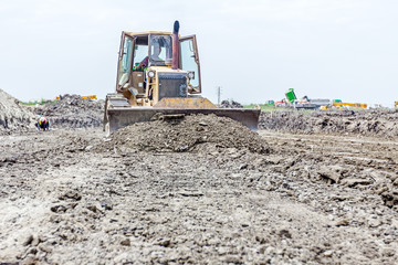 Fototapeta premium Front side of heavy earthmover construction machine in action