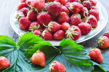 Fresh ripe strawberries on a wooden table